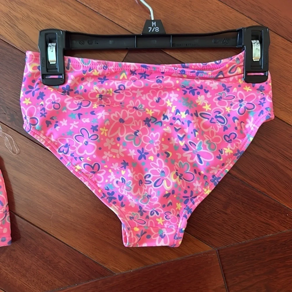 Girls set of swimsuits, pink set is a 7/8 and the one piece is a small.